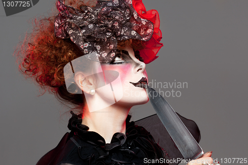 Image of woman mime with knife