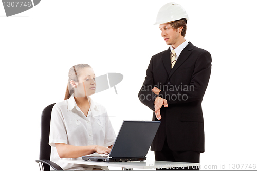 Image of Two businesspeople working with laptop