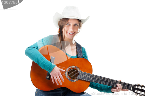 Image of cowgirl in ahat with acoustic guitar