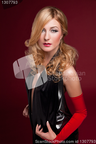 Image of Perfect blonde in a black dress on red