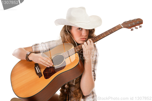 Image of Sesy cowgirl in cowboy hat with acoustic guitar