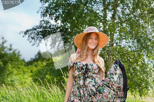 Image of Young beautiful girl with hat posing outdoor