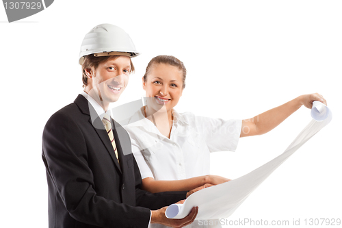 Image of An architect wearing a hard hat and co-worker