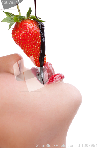 Image of girl eating strawberry with chocolate sauc