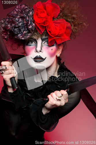 Image of woman mime with knife