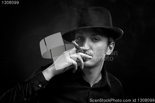 Image of Man with hat and cigar in Black & White