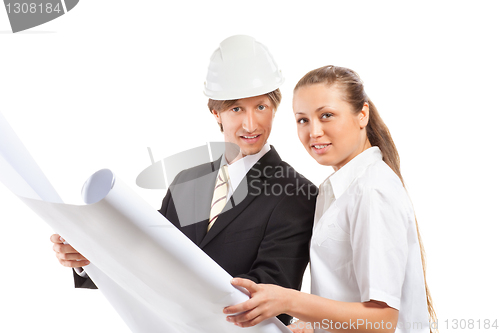 Image of An architect wearing a hard hat and co-worker