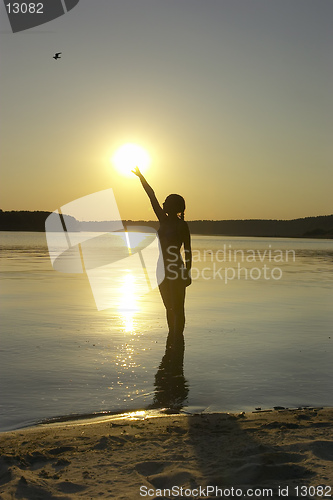 Image of girl on the evening beach