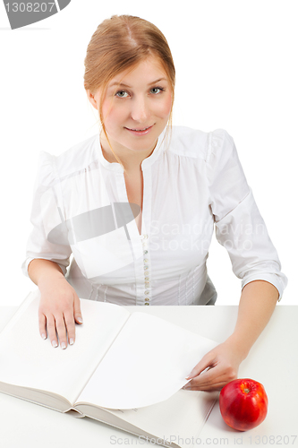 Image of woman with apple and book