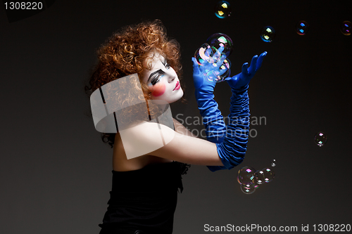 Image of woman mime with soap bubbles.