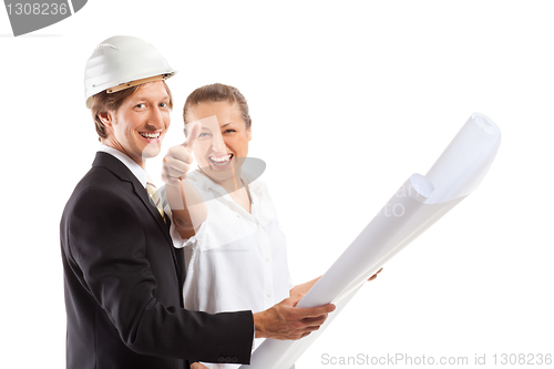 Image of An architect wearing a hard hat and co-worker