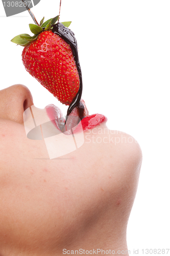 Image of girl eating strawberry with chocolate sauc