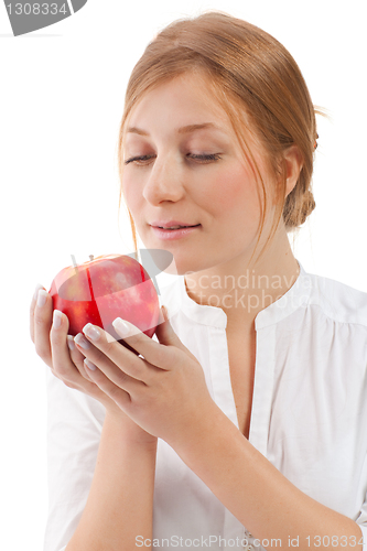 Image of Beautiful woman holding apple