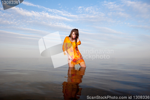 Image of girl posing in the Water at sunset