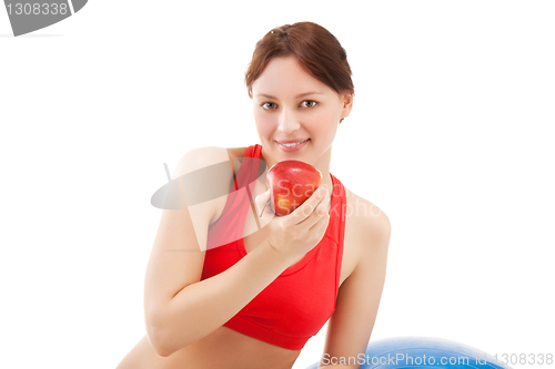 Image of woman in sportswear with apple