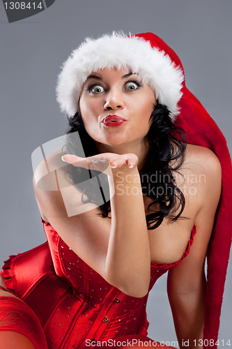 Image of Beautiful christmas woman in santa hat