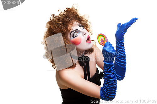 Image of woman mime with theatrical makeup singing