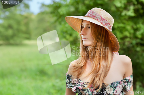 Image of Young beautiful girl with hat posing outdoor