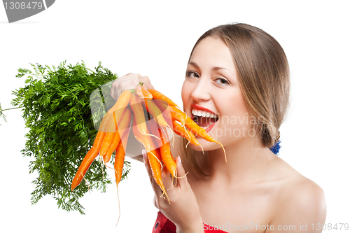 Image of attractive woman holds bunch of carrots