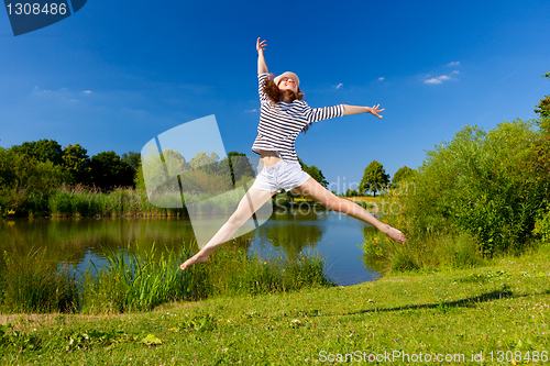Image of pretty young woman jumping