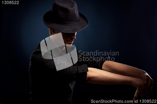 Image of man in a black hat