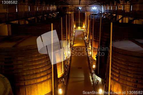 Image of wine barrels in a winery, France