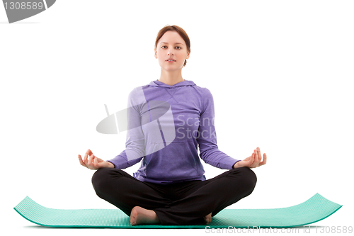 Image of Young woman practicing yoga