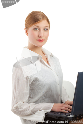 Image of Beautiful smiling businesswoman looking at camera