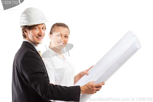 Image of An architect wearing a hard hat and co-worker