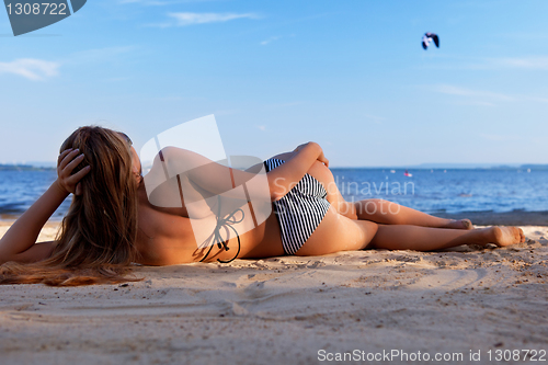 Image of girl lying on a beach