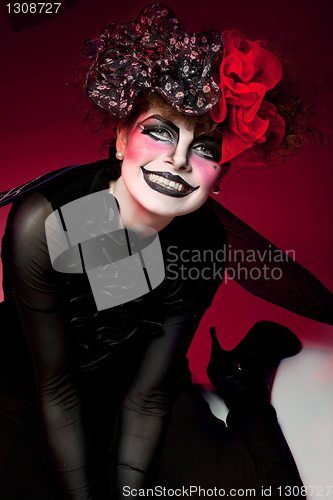 Image of woman mime with knife