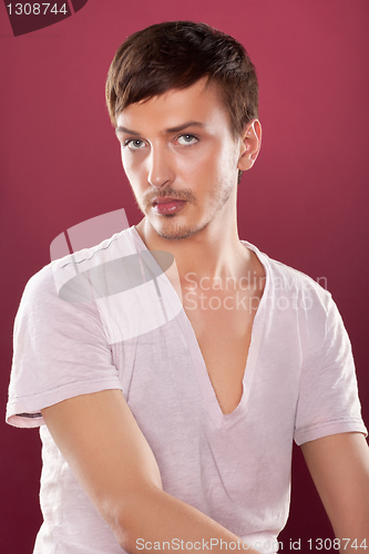 Image of Young handsome man in a white shirt over red