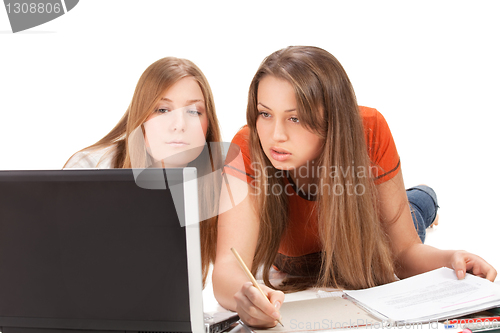 Image of two young happy student girl, isolated on white