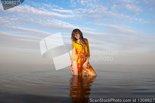 Image of girl posing in the Water at sunset