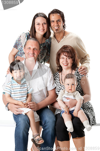 Image of Studio Shot Of Family Group Sitting In Studio