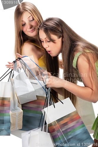 Image of Shopping. Two beautiful girl with bag