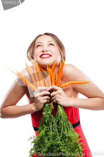 Image of attractive woman holds bunch of carrots