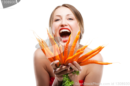 Image of attractive woman holds bunch of carrots