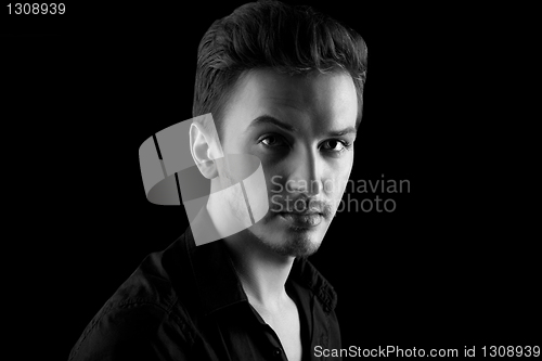 Image of Young man's portrait in back & wite