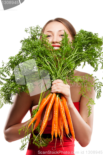 Image of attractive woman holds bunch of carrots
