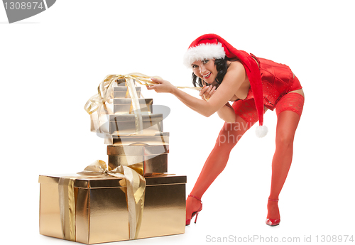 Image of Beautiful christmas woman in santa hat