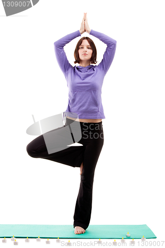 Image of Young woman practicing yoga