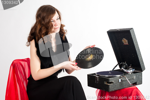 Image of Beautiful woman with gramophone,