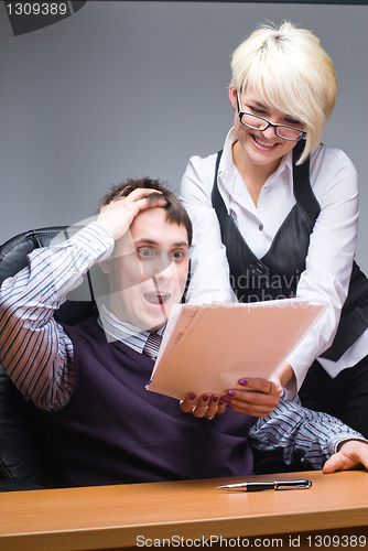 Image of Businesspeople reading documents