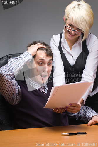 Image of Businesspeople reading documents