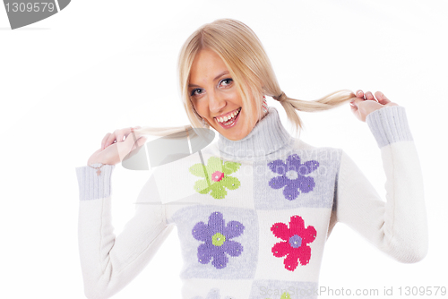 Image of Pretty woman with hands in hair