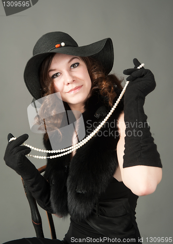 Image of Young woman with beads