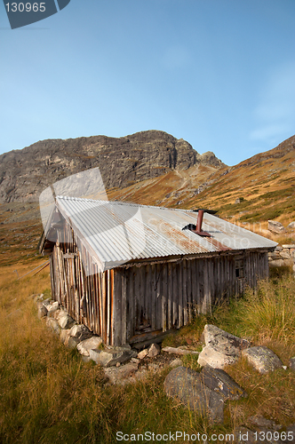 Image of Cabin in mountain landscape