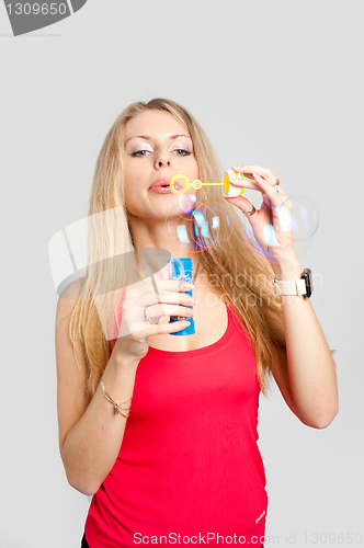 Image of Pretty girl with soap bubbles