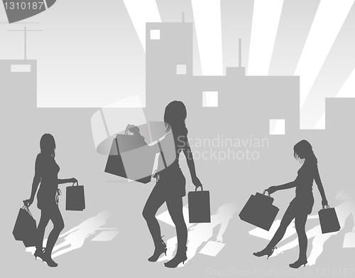 Image of Silhouettes shopping girls on urban background